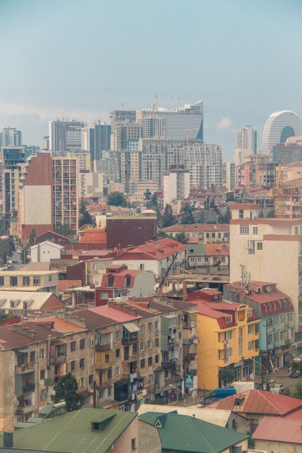 a view of a city with tall buildings