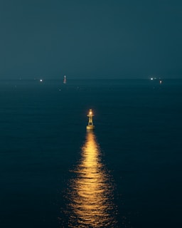 a full moon shines brightly on the water