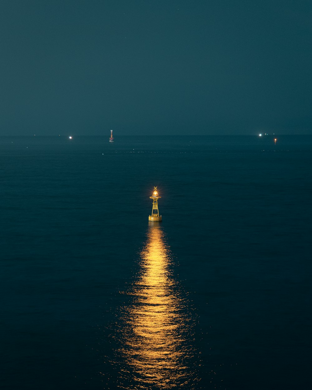 a full moon shines brightly on the water