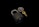 A brass padlock lies on a reflective black surface accompanied by a gold key attached to a circular keychain with colored segments.
