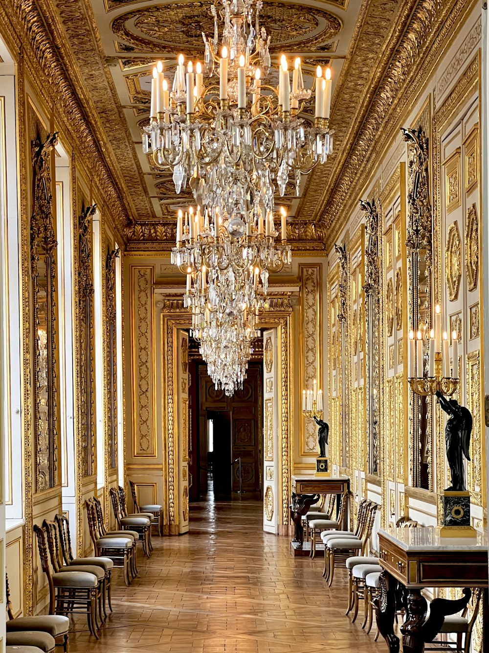 a long hallway with a chandelier hanging from the ceiling