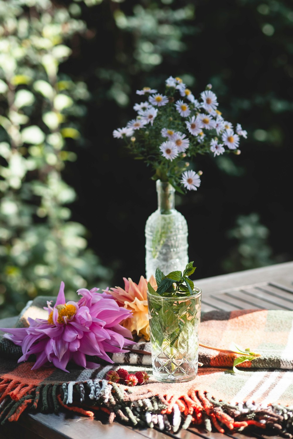 a vase of flowers sitting on top of a table