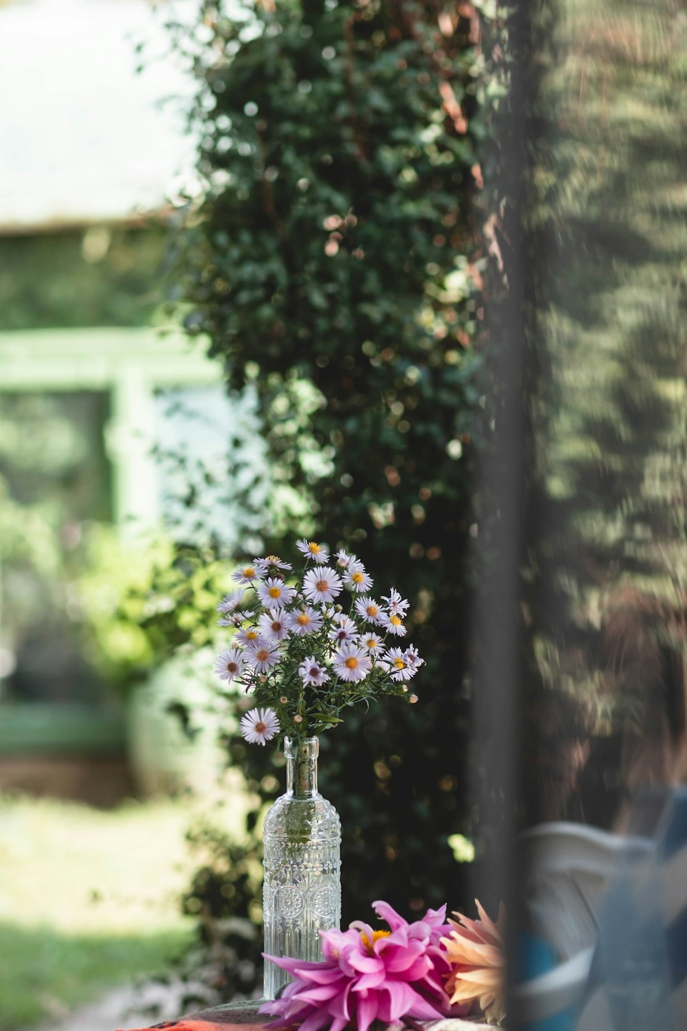 a vase of flowers sitting on top of a table