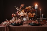 A romantic table setting adorned with floral centerpieces.