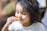 Smiling child happily eating rice during a hypnotherapy session