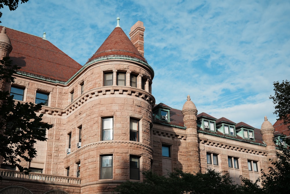 a large brick building with a clock on the top of it