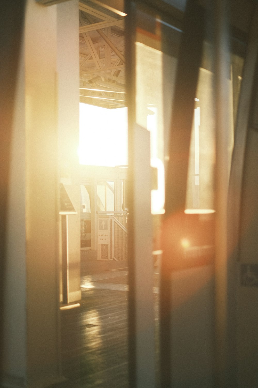 the sun is shining through the window of a train