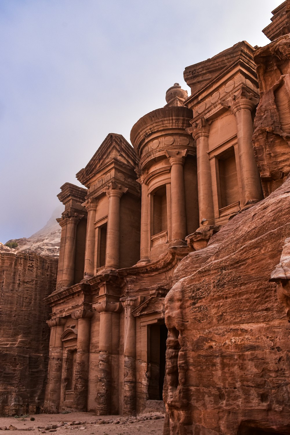 a group of buildings built into the side of a mountain