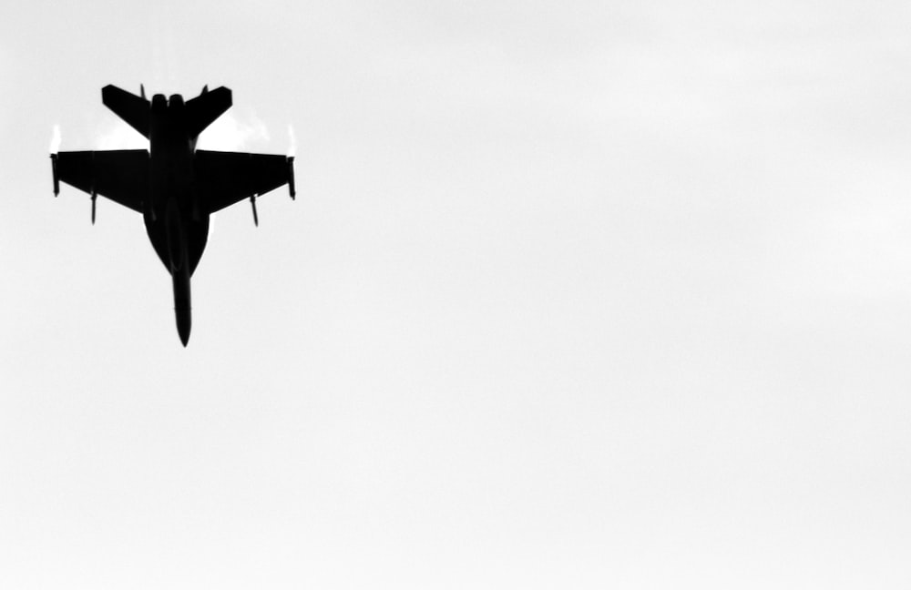 a black and white photo of a fighter jet