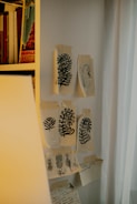 Creative sketches and mood boards pinned on a wall.