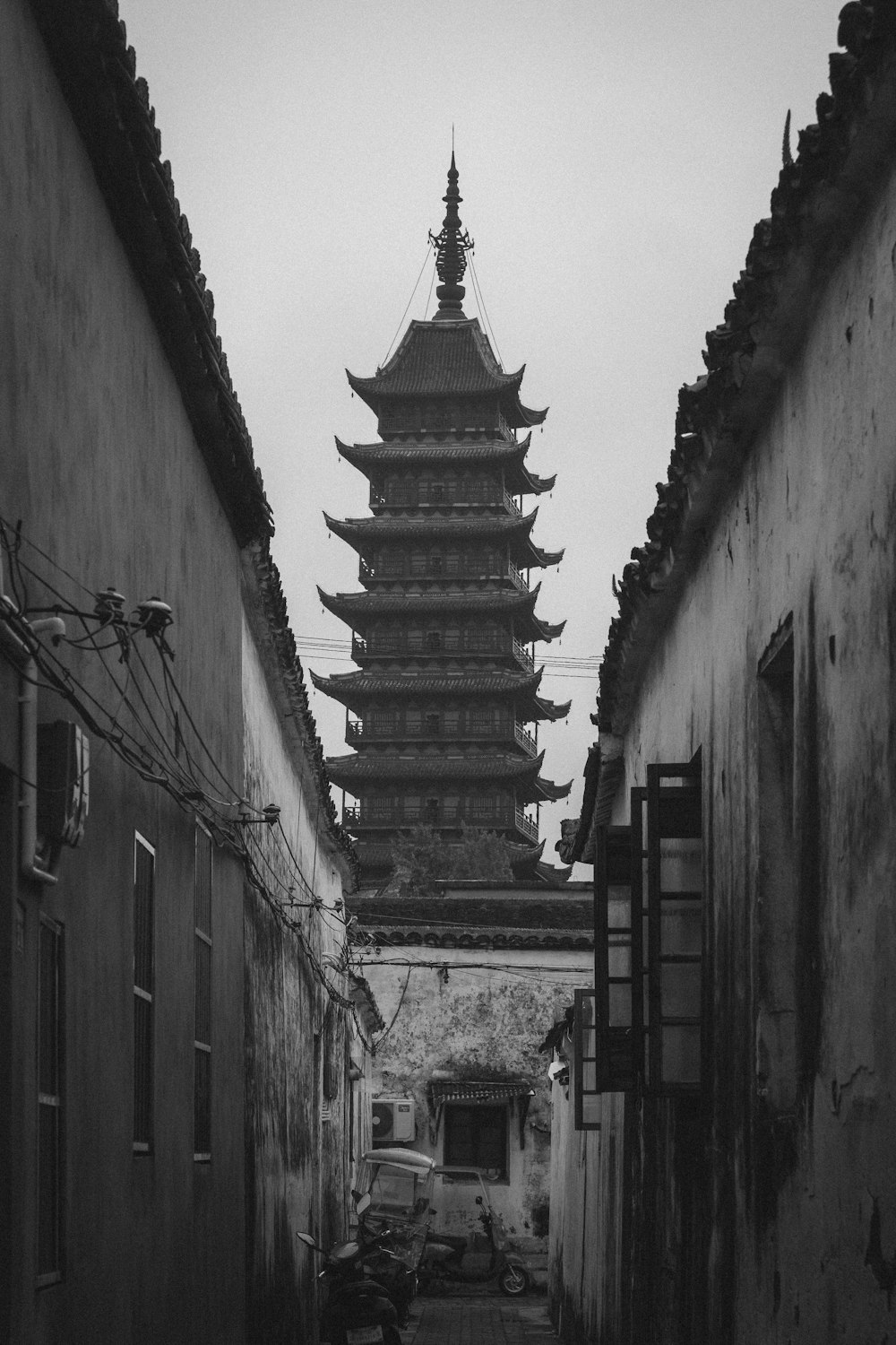 a black and white photo of an alley way