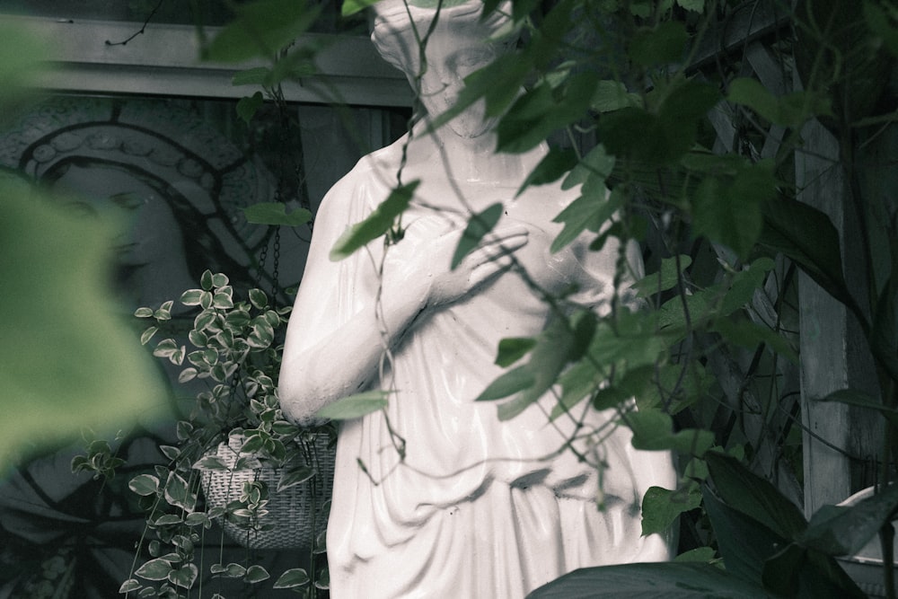 a statue of a man holding a basket of flowers