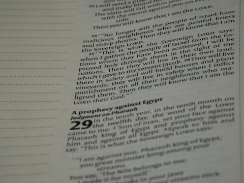 Printed text featuring scripture from a religious book, specifically focusing on prophecies and judgments. The text is organized in paragraphs with certain notable words in bold, and page numbers are visible.