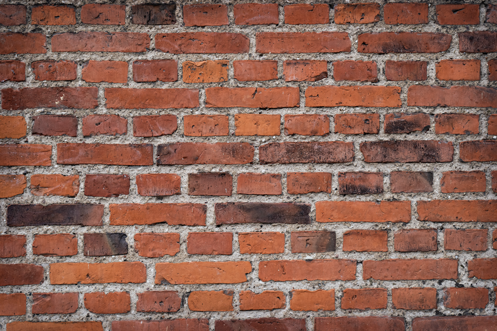 a close up of a red brick wall