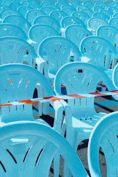 Crowd control barriers arranged neatly around an outdoor event, with safety yellow accents visible.