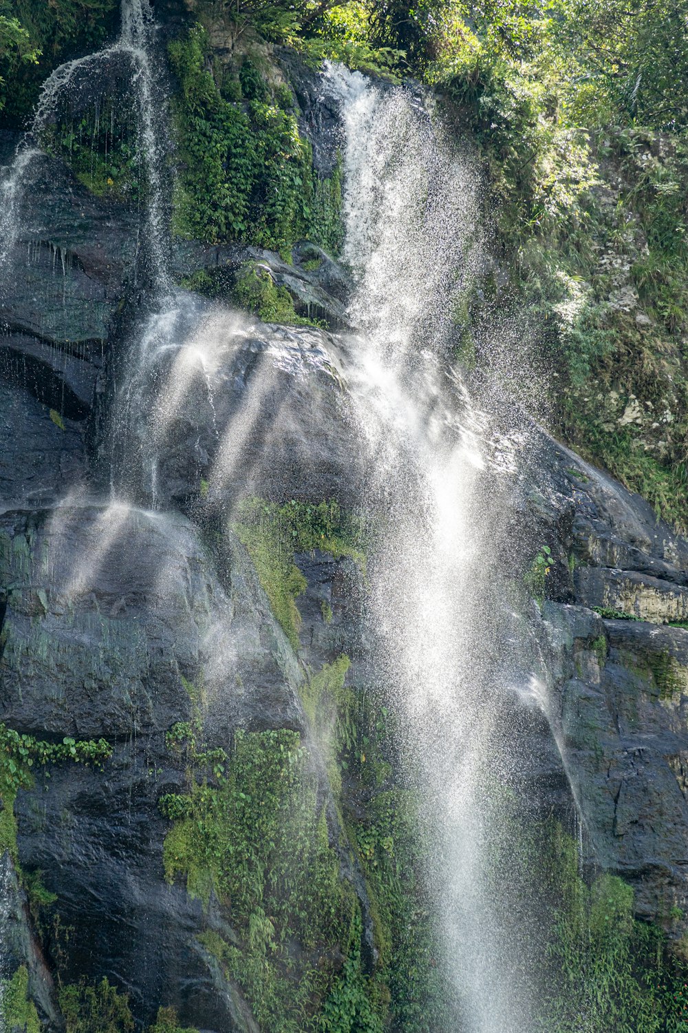 a large waterfall with lots of water coming out of it