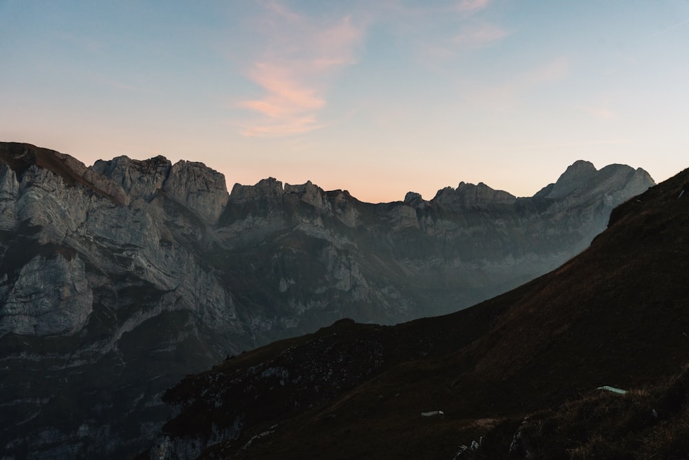 a view of a mountain range at sunset