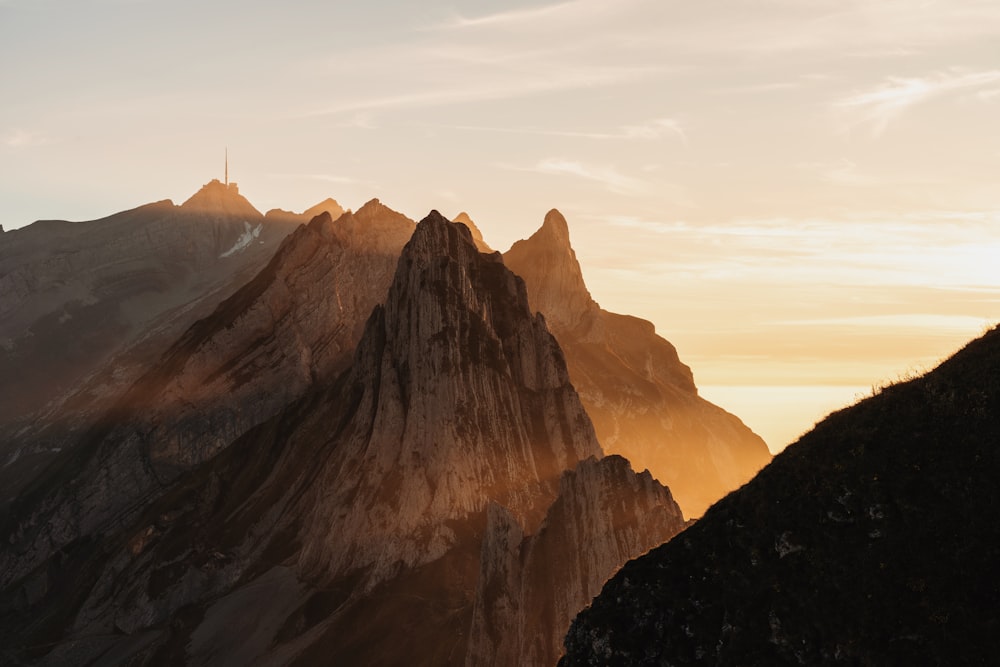 a view of a mountain range at sunset