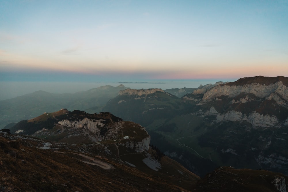 a view of a mountain range at sunset