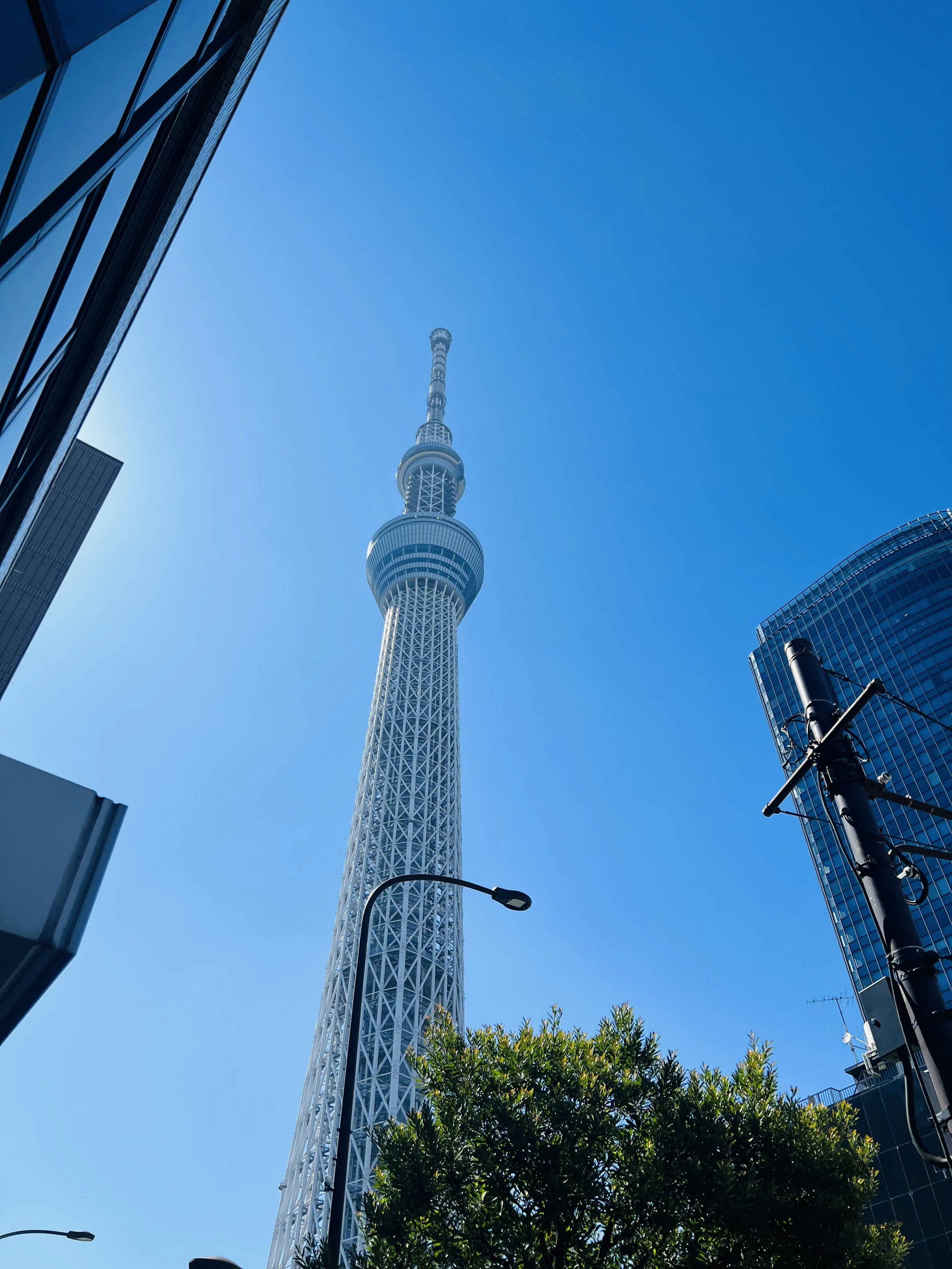 a very tall tower towering over a city