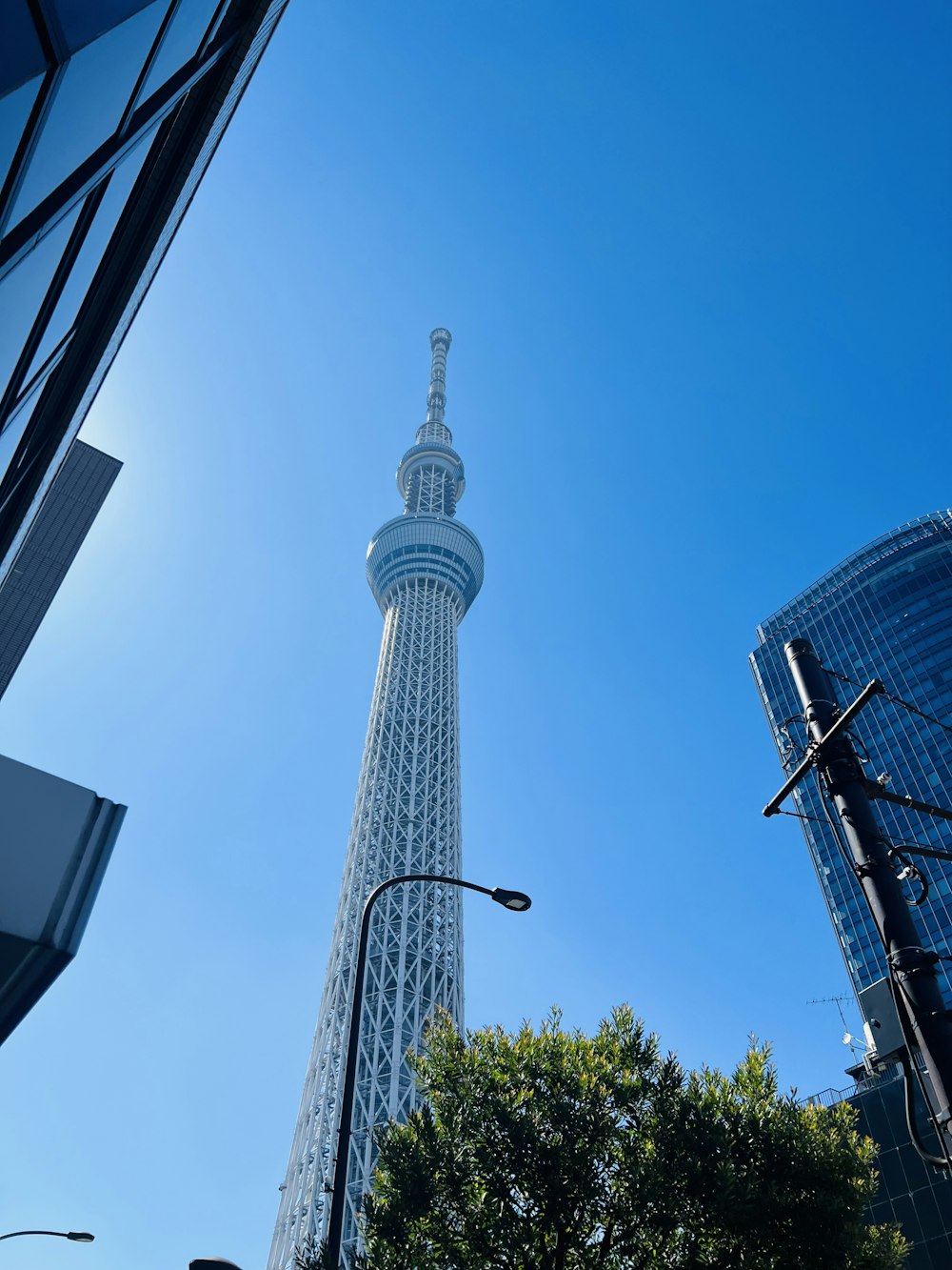 a very tall tower towering over a city