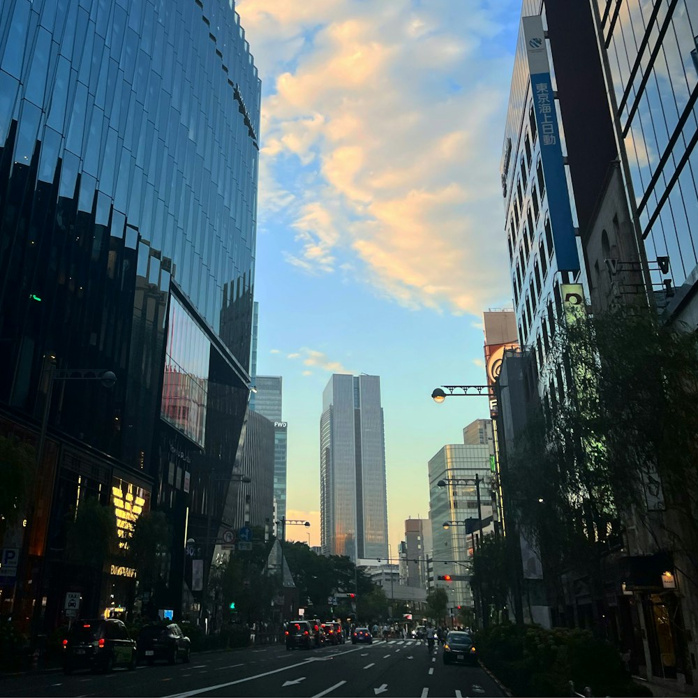 a city street with tall buildings and a traffic light