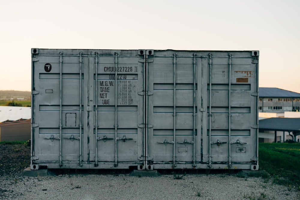 a train car sitting on top of a gravel road