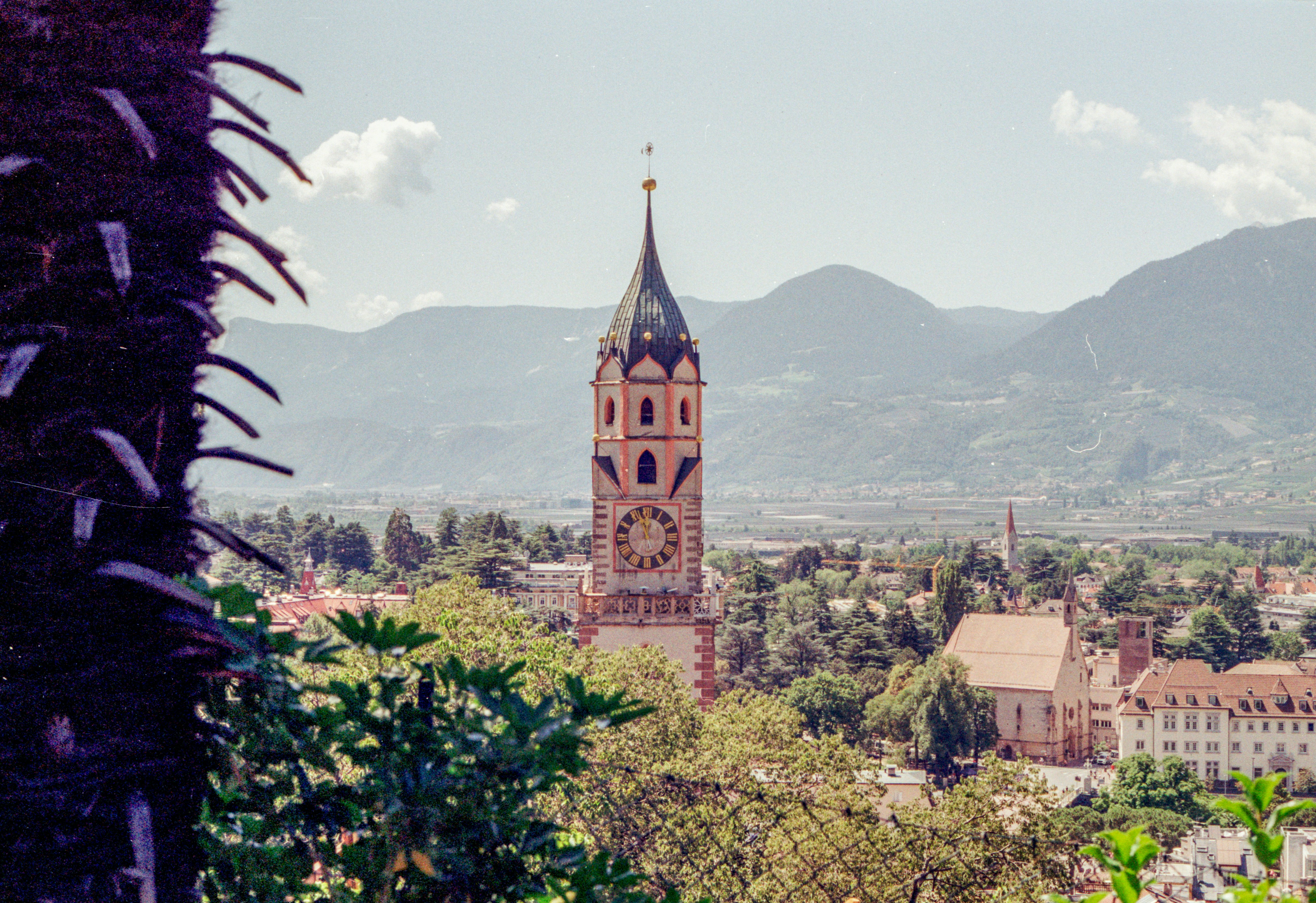 a tall clock tower towering over a city