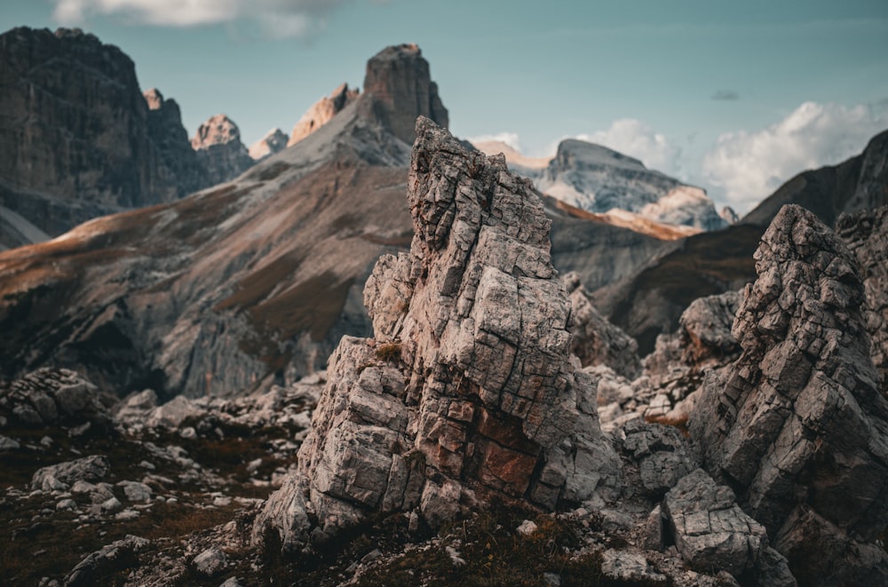 a mountain range with rocks and mountains in the background