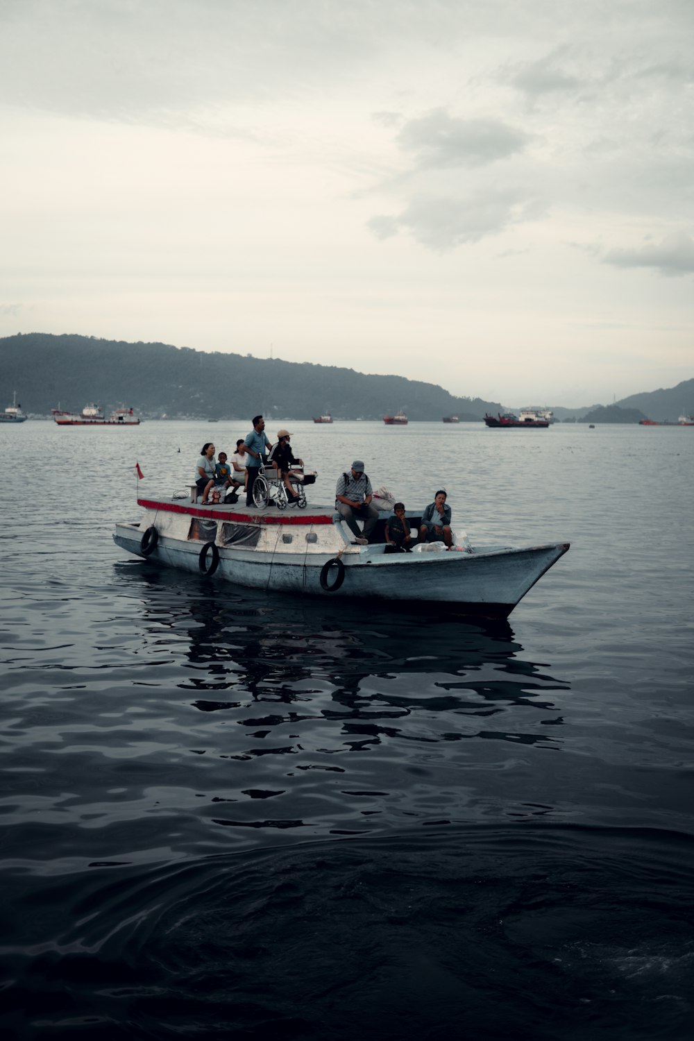 a group of people riding on the back of a boat