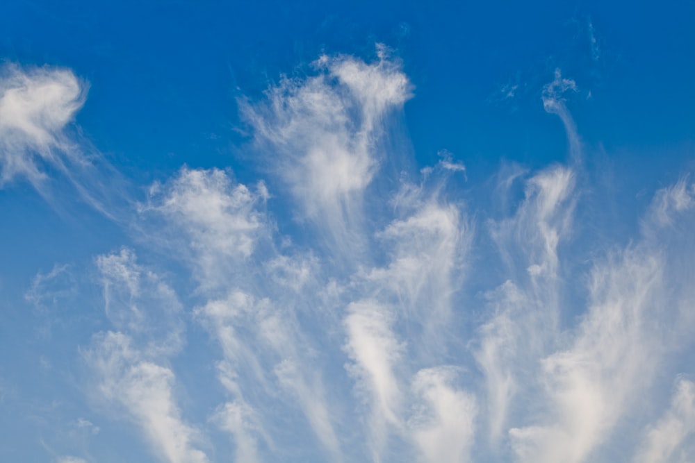 a blue sky with some clouds in it