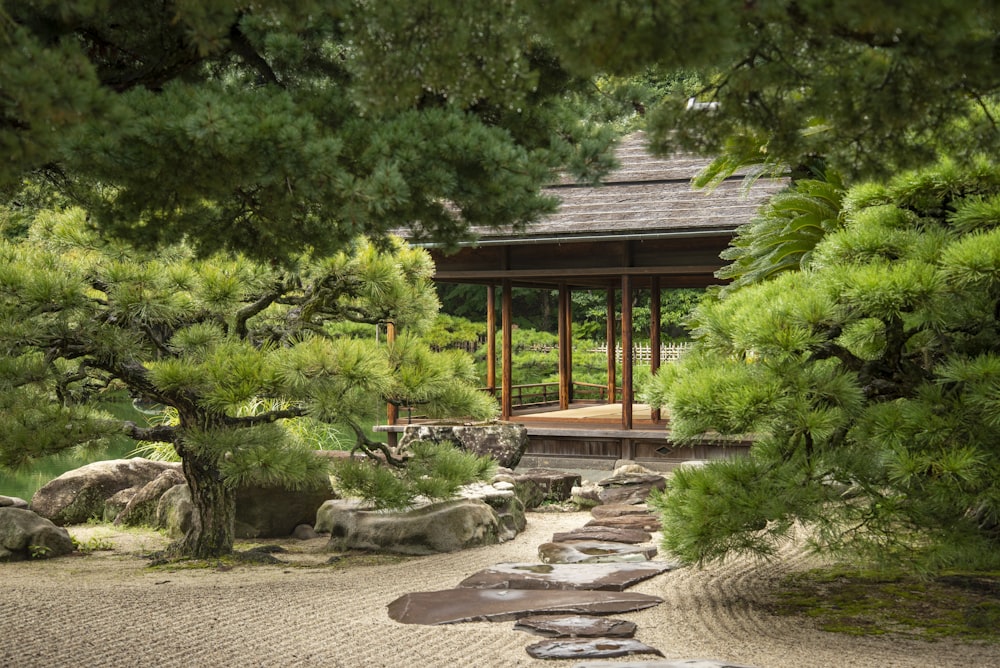 a japanese garden with rocks and trees