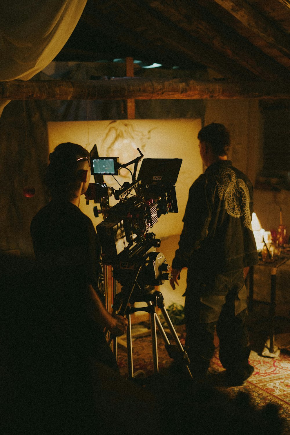 a couple of people standing in front of a camera