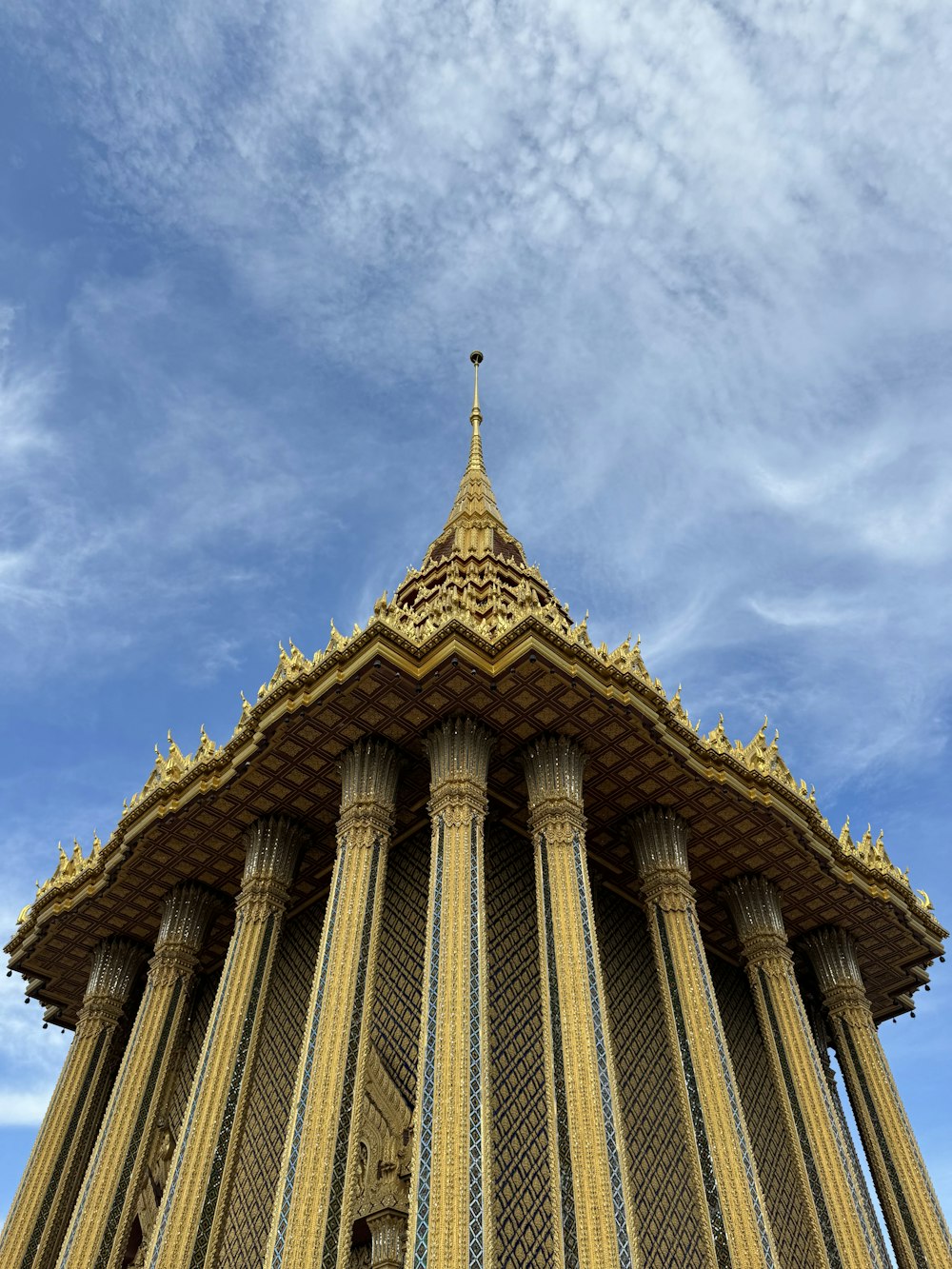 a tall tower with a cross on top of it