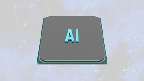 A grey processor chip with the letters 'AI' prominently displayed in blue, set against a subtle background with faint outlines of a map.