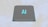 A grey processor chip with the letters 'AI' prominently displayed in blue, set against a subtle background with faint outlines of a map.