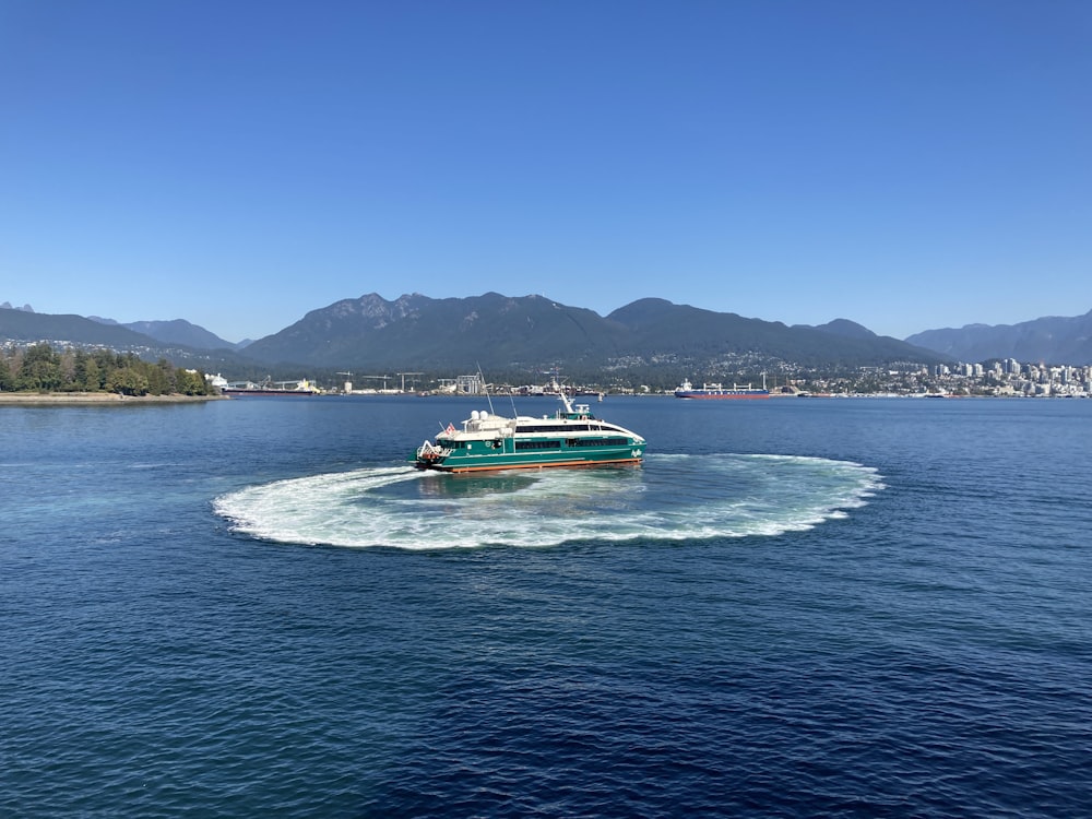 a boat traveling across a large body of water