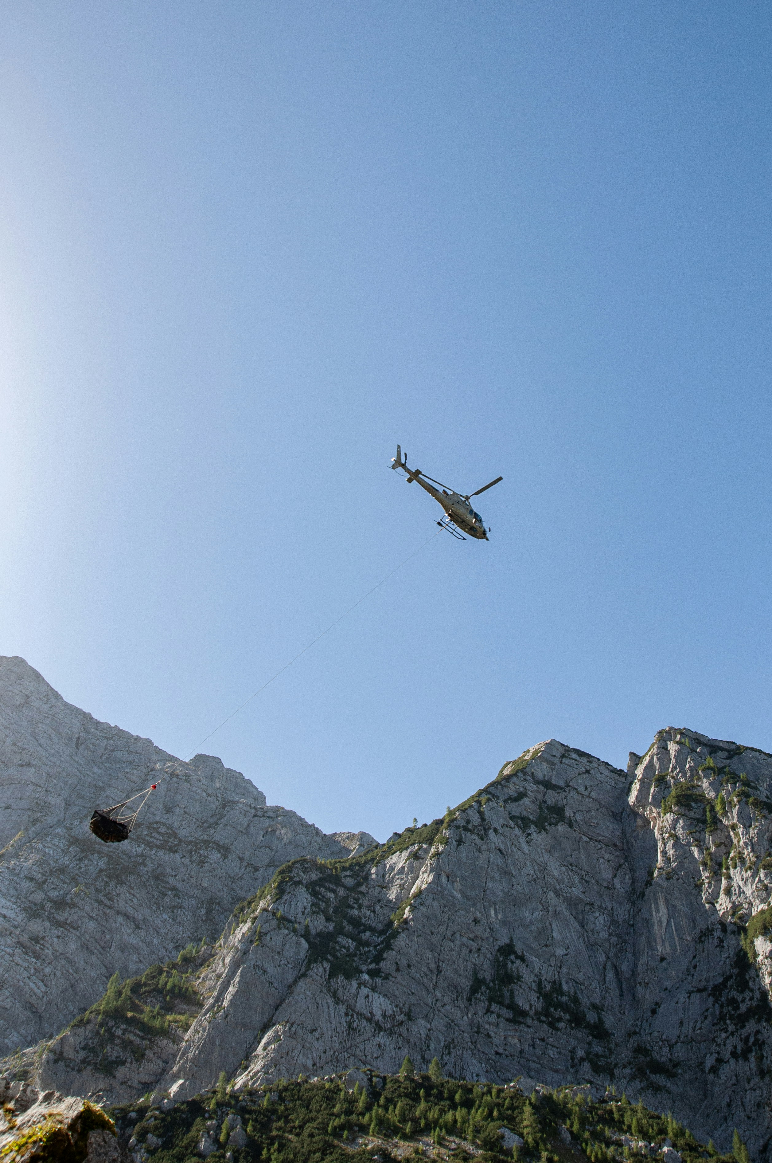 an airplane is flying over a mountain range