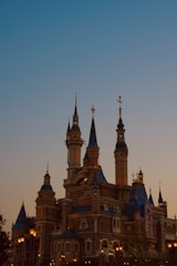 A sprawling Minecraft castle glowing under a mystical sunset.