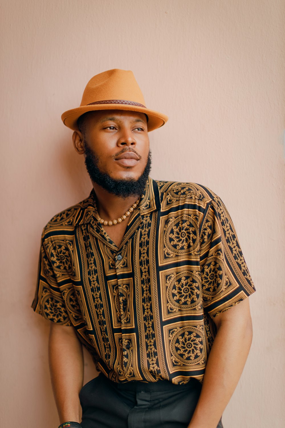 a man with a beard wearing a hat