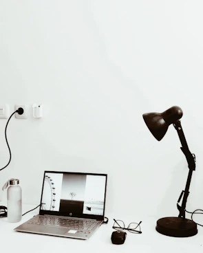 Minimalist workspace featuring snapgo360 imaging accessories neatly arranged on a white desk.