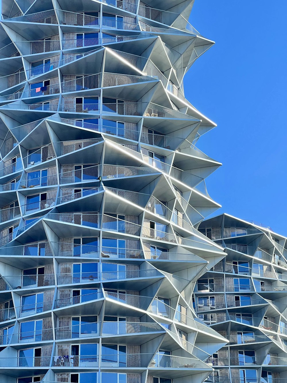 a very tall building with many windows and balconies