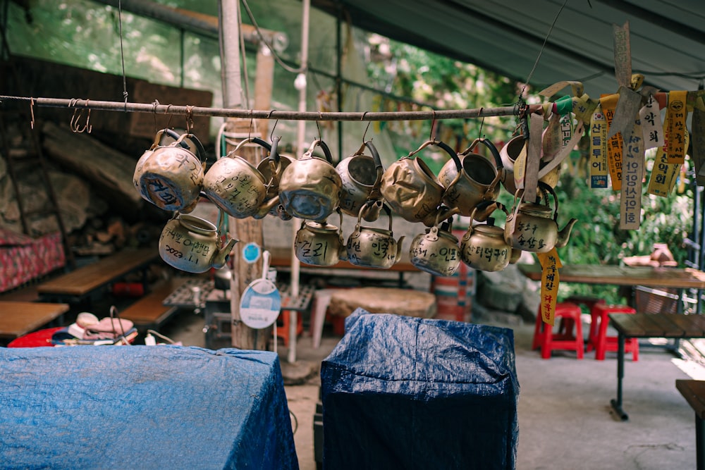 a bunch of bells hanging from a line