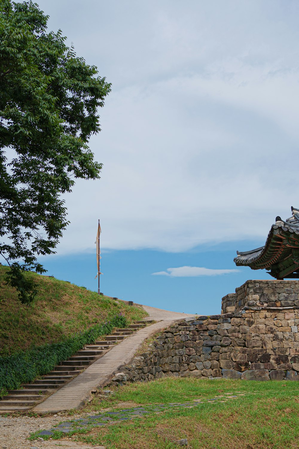 a stone wall with steps leading up to it