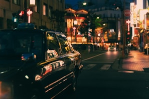 A stylish cab parked against an urban backdrop.