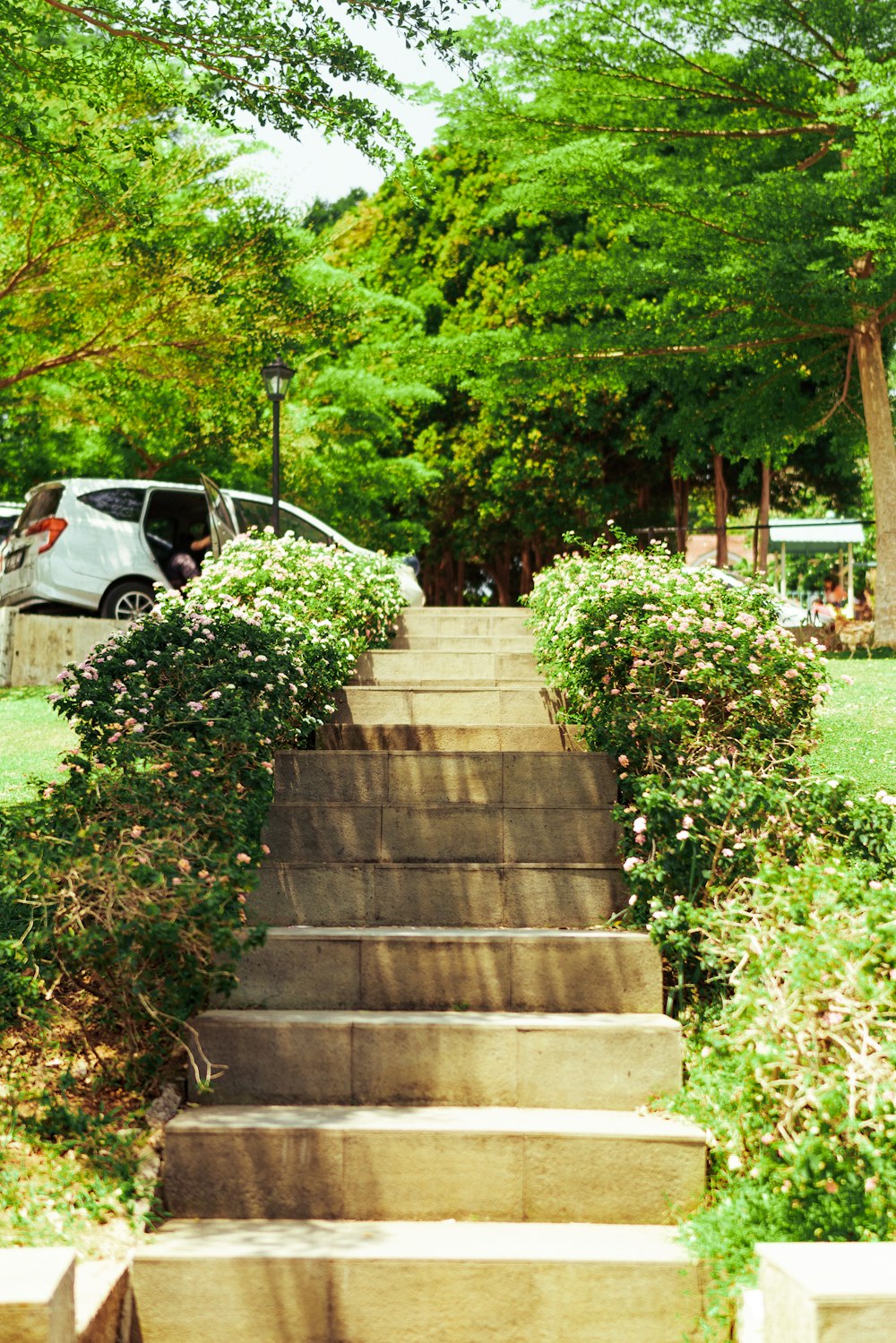 a car is parked on the side of a set of stairs