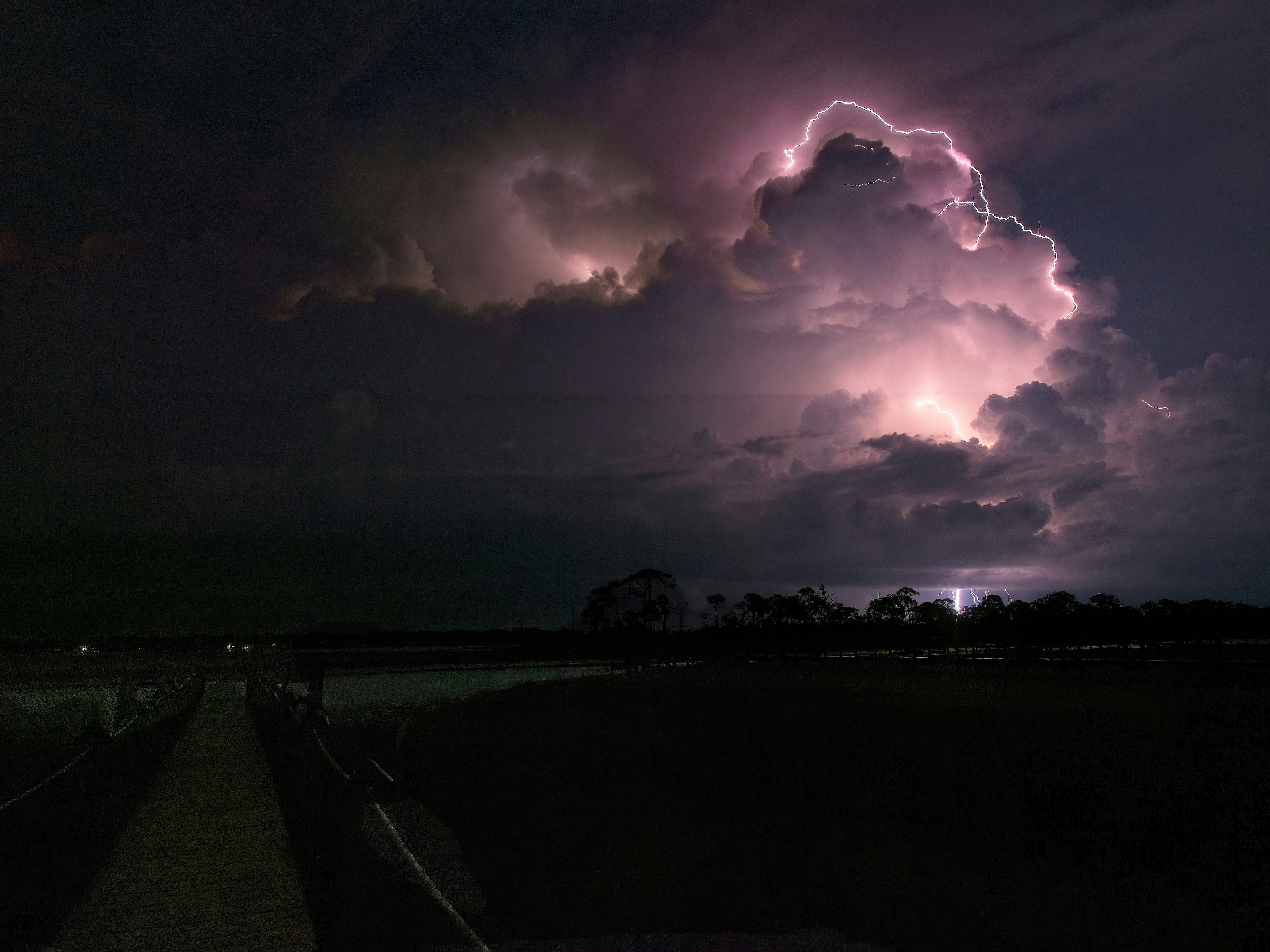 a large cloud filled with lots of lightning