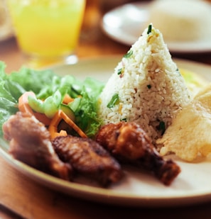 a white plate topped with meat and veggies