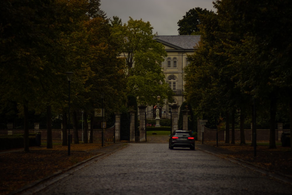 a car is parked in front of a large building