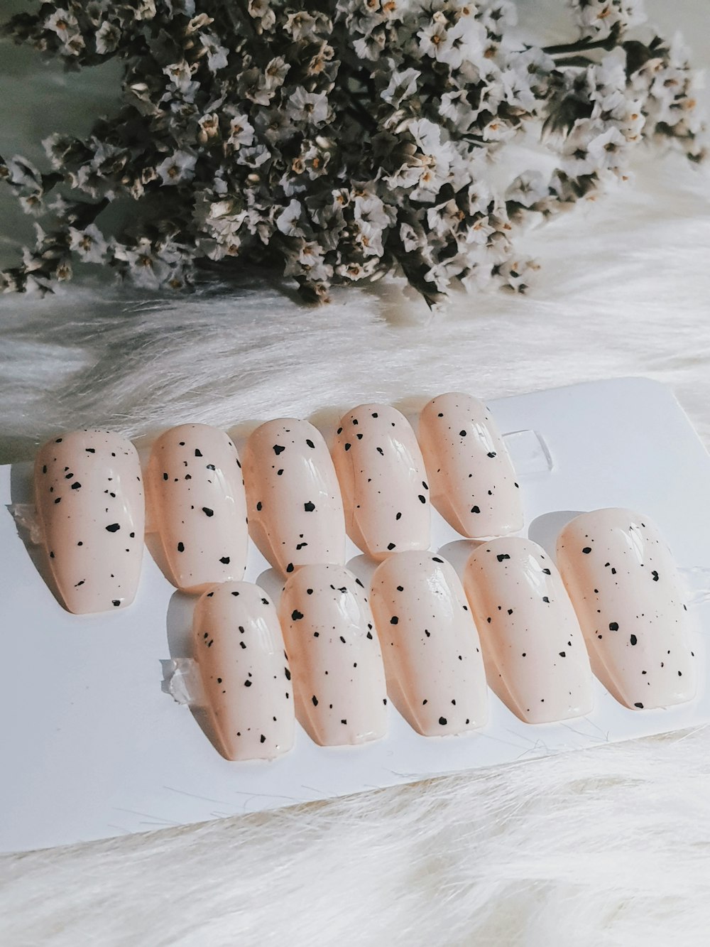 a bunch of fake nails sitting on top of a table